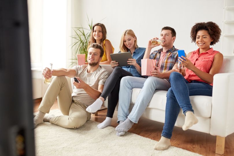 people watching TV on phone at home